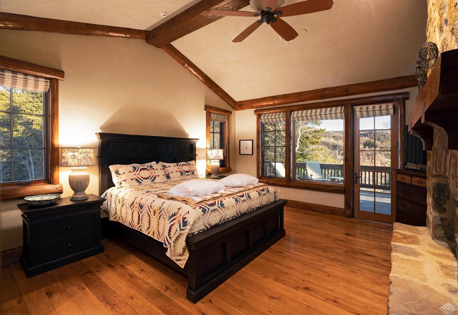 303 Graham Road Edwards, CO 81632 - Photo 4 of 13 a bedroom with a bed and wooden floor