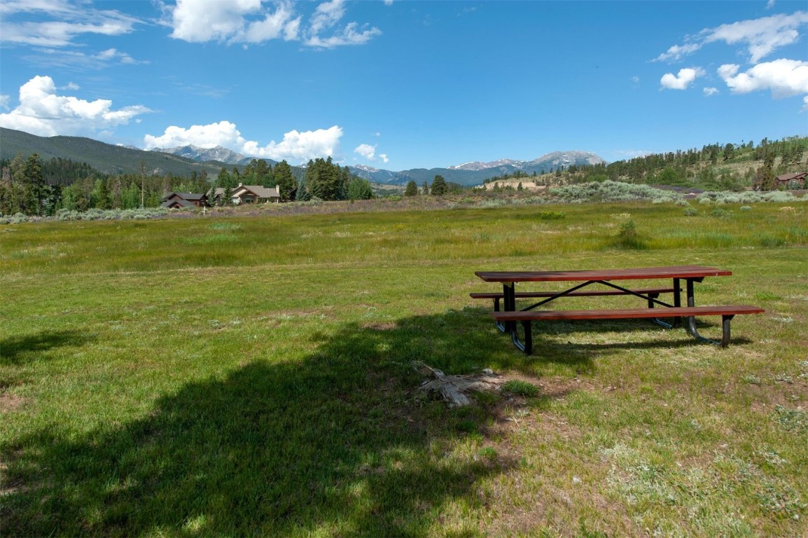 21630 Highway 6, Unit 2150 Keystone, CO 80435 - Photo 15 of 46 a view of a lake with a table and chairs