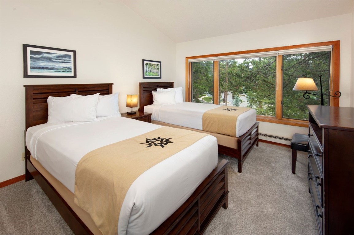 21630 Highway 6, Unit 2150 Keystone, CO 80435 - Photo 25 of 46 a bedroom with bed and a large window