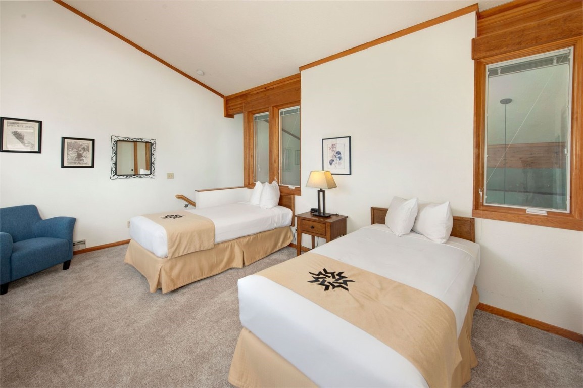 21630 Highway 6, Unit 2150 Keystone, CO 80435 - Photo 30 of 46 a bedroom with two beds and a large window