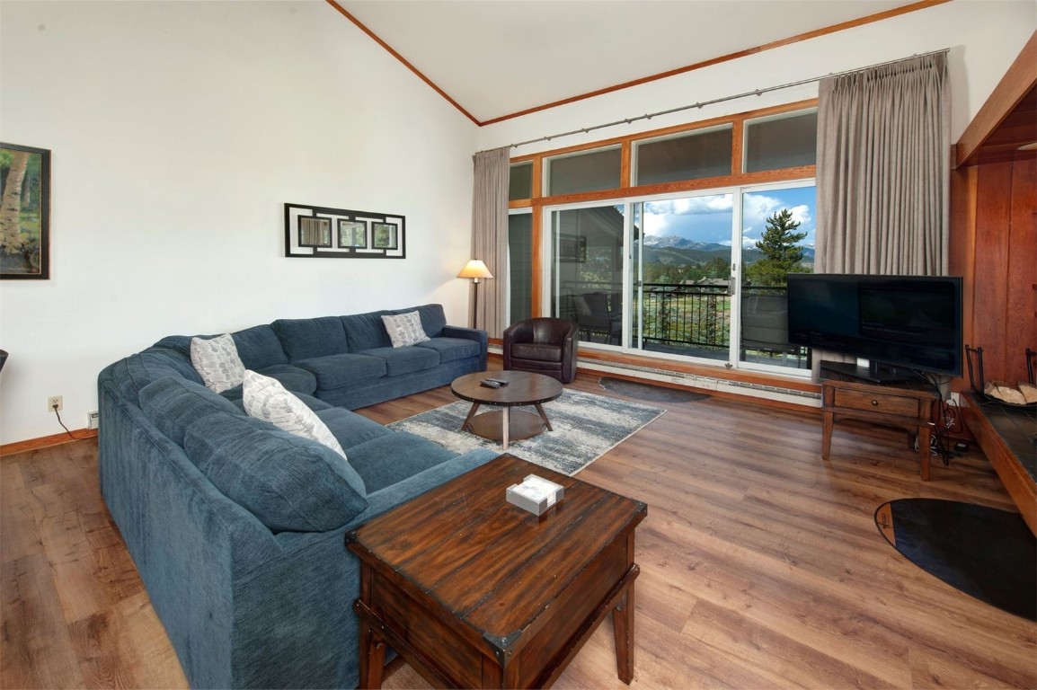 21630 Highway 6, Unit 2150 Keystone, CO 80435 - Photo 4 of 46 a living room with furniture a flat screen tv and a large window