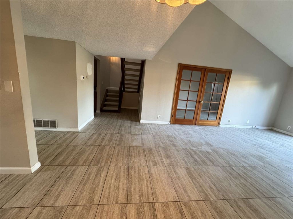 6733 Caro Street, Unit 47 Paramount, CA 90723 - Photo 15 of 25 an empty room with wooden floor and closet