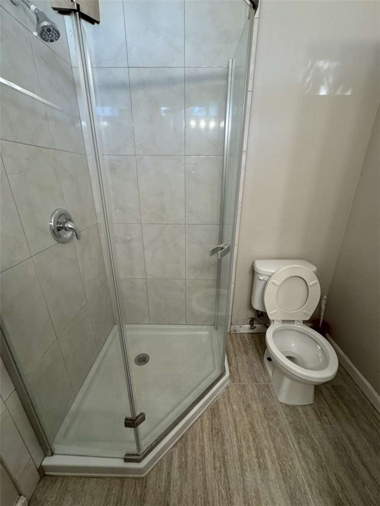 6733 Caro Street, Unit 47 Paramount, CA 90723 - Photo 19 of 25 a bathroom with a toilet and a shower