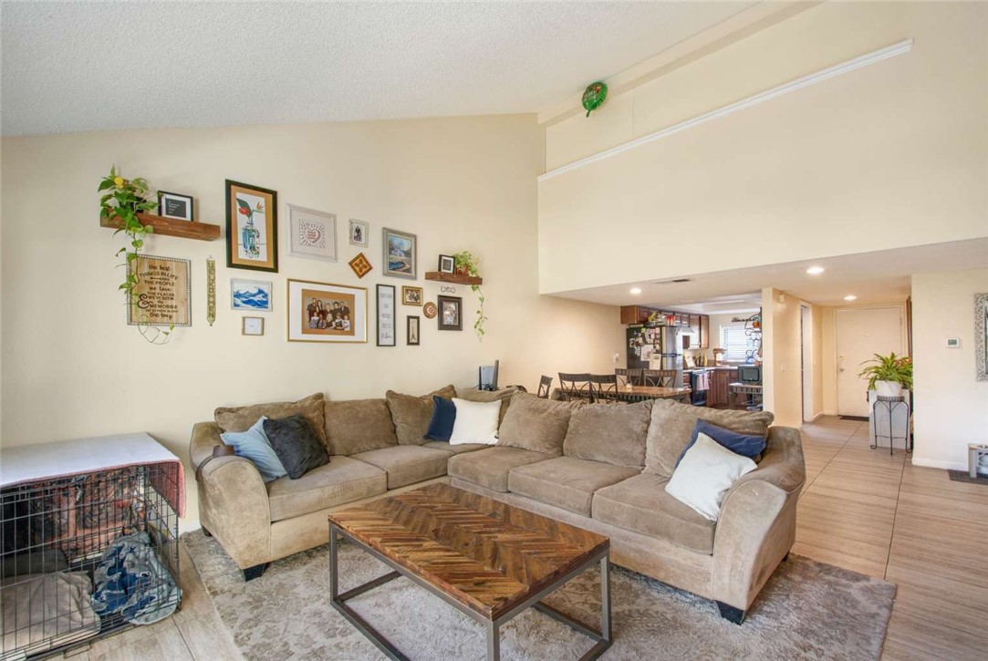 6733 Caro Street, Unit 47 Paramount, CA 90723 - Photo 2 of 25 a living room with furniture and a couch
