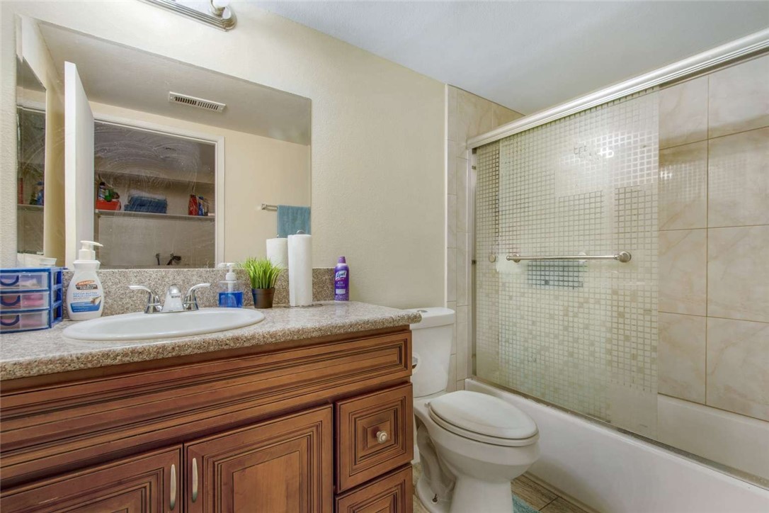 6733 Caro Street, Unit 47 Paramount, CA 90723 - Photo 6 of 25 a bathroom with a sink a toilet and shower