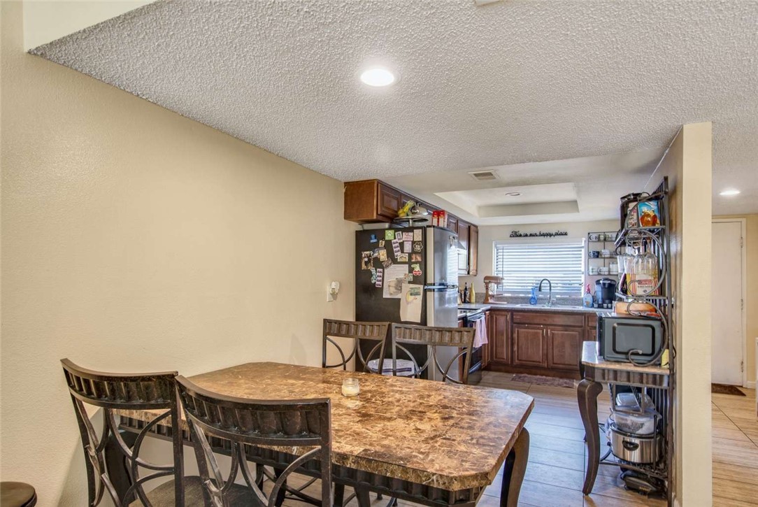 6733 Caro Street, Unit 47 Paramount, CA 90723 - Photo 9 of 25 a view of a dining room with furniture and window
