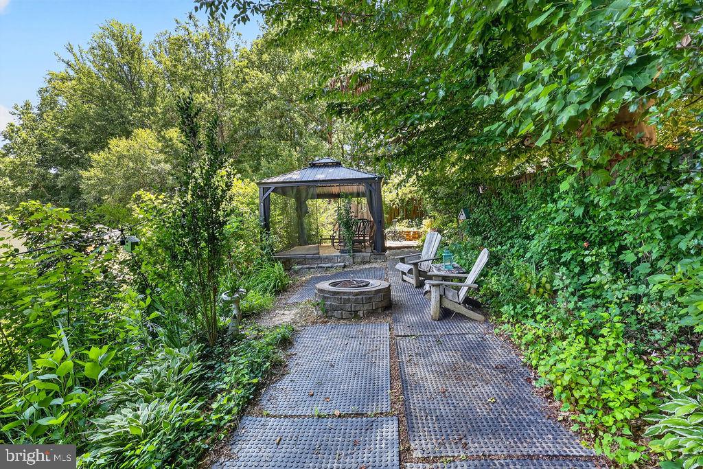8471 Great Lake Lane Springfield, VA 22153 - Photo 47 of 65 a view of a patio with table and chairs and potted plants