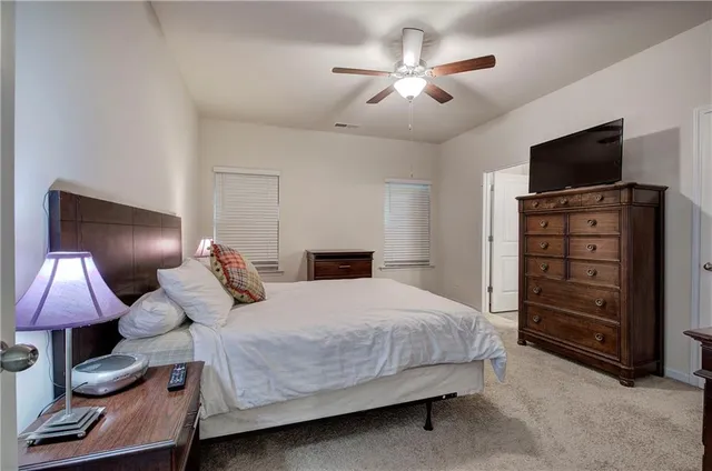 a kitchen with stainless steel appliances granite countertop wooden cabinets sink stove and refrigerator