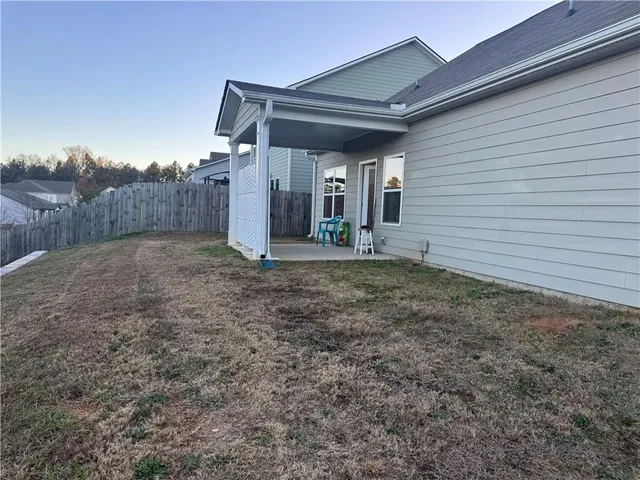 a living room with a couch and a window