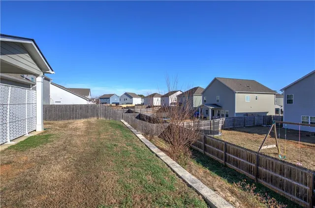 a bathroom with a sink a toilet and shower curtain