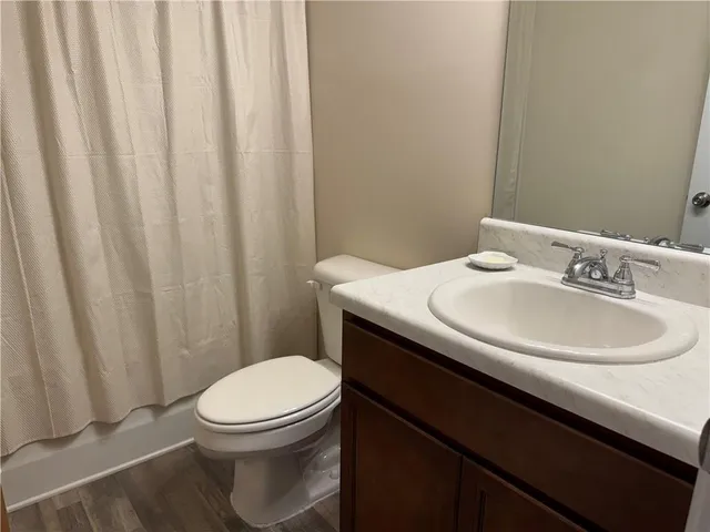 a bathroom with a shower and a mirror