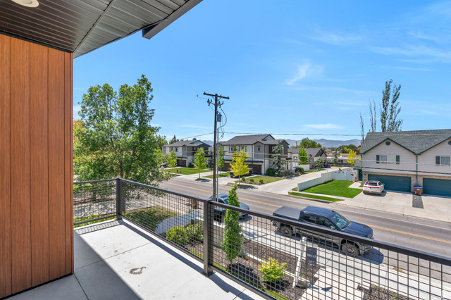 7045 South 300 East Midvale, UT 84047 - Photo 20 of 49 Balcony with concrete flooring and dark metal mesh railing
