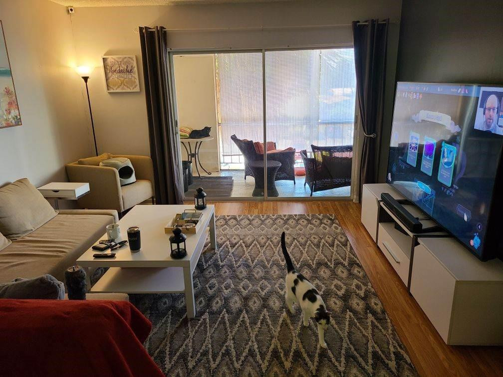 632 Northwest 13th Street Boca Raton, FL 33486 - Photo 6 of 12 a living room with furniture and a flat screen tv