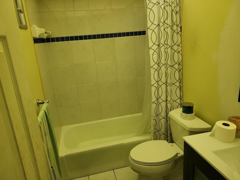 632 Northwest 13th Street Boca Raton, FL 33486 - Photo 8 of 12 a bathroom with a toilet and a shower
