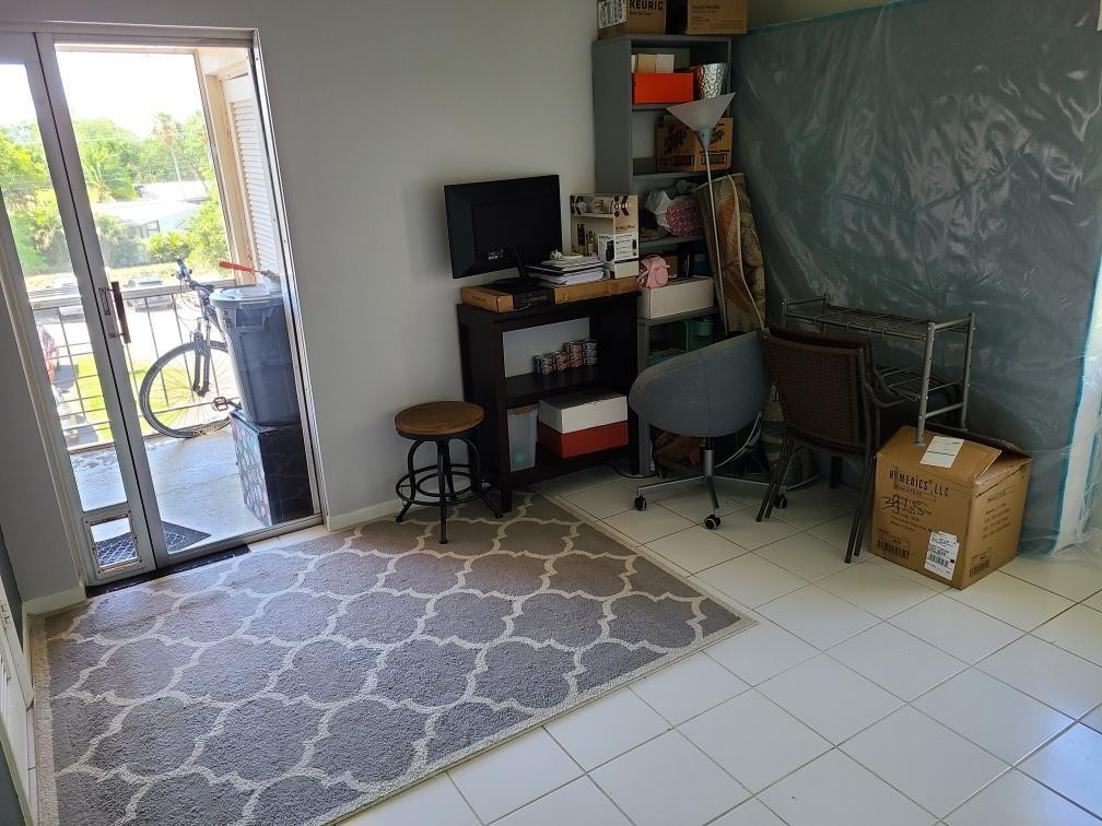 632 Northwest 13th Street Boca Raton, FL 33486 - Photo 9 of 12 a view of a workspace with furniture and a window