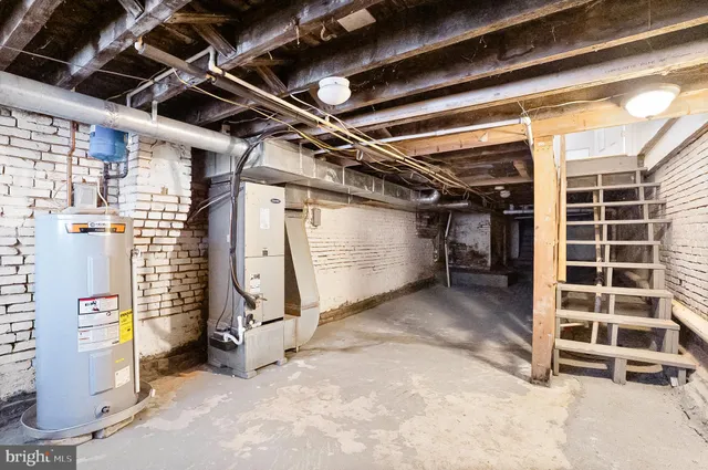 a view of an empty room with a staircase