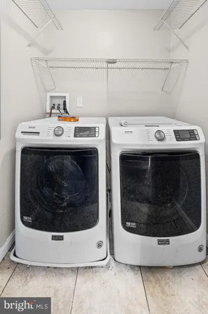 a stove top oven sitting inside of a kitchen