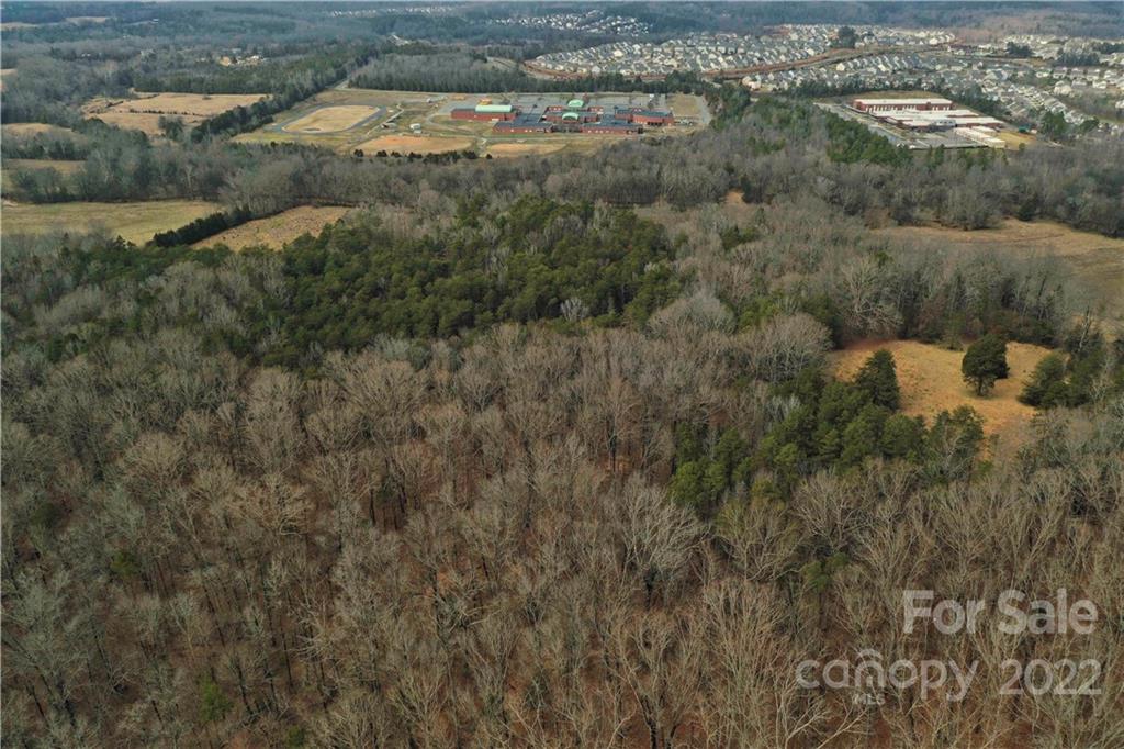 460 Pine Grove Church Road Concord, NC 28025 - Photo 23 of 45 a view of a lake with lots of trees