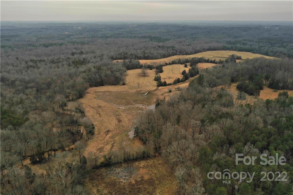 460 Pine Grove Church Road Concord, NC 28025 - Photo 4 of 45 a view of a dry yard with wooden fence