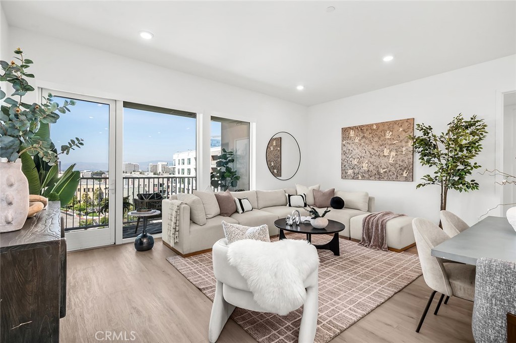 3604 Rivington Irvine, CA 92612 - Photo 6 of 54 a living room with furniture potted plant and a large window