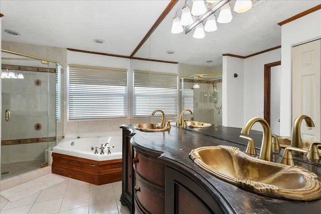 a bathroom with a granite countertop sink a mirror and bathtub