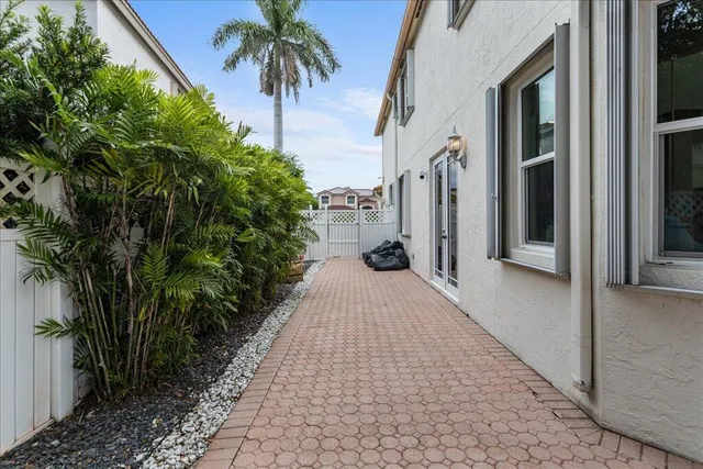 a view of a pathway both side of house