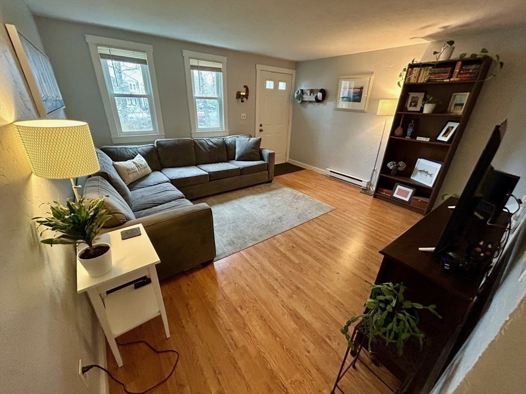 300 Falmouth Road, Unit 6B Mashpee, MA 02649 - Photo 11 of 27 a living room with furniture and a flat screen tv