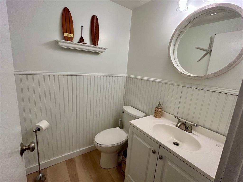 300 Falmouth Road, Unit 6B Mashpee, MA 02649 - Photo 13 of 27 a bathroom with a toilet sink and mirror