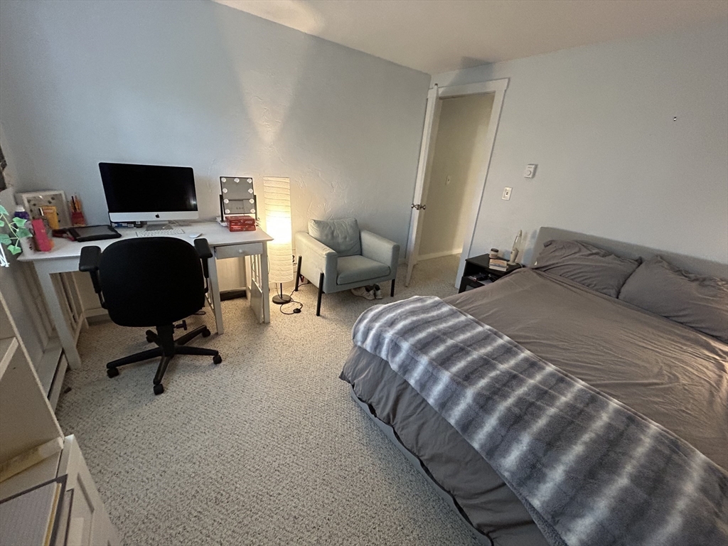 300 Falmouth Road, Unit 6B Mashpee, MA 02649 - Photo 20 of 27 a bedroom with a bed computer on desk and a chair