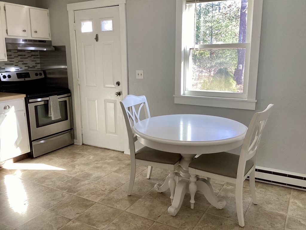 300 Falmouth Road, Unit 6B Mashpee, MA 02649 - Photo 5 of 27 a view of a dining room with furniture