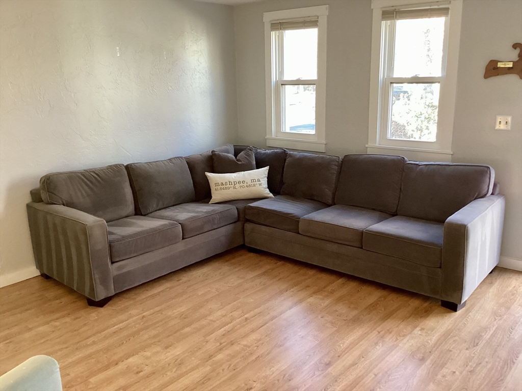 300 Falmouth Road, Unit 6B Mashpee, MA 02649 - Photo 9 of 27 a living room with furniture and windows