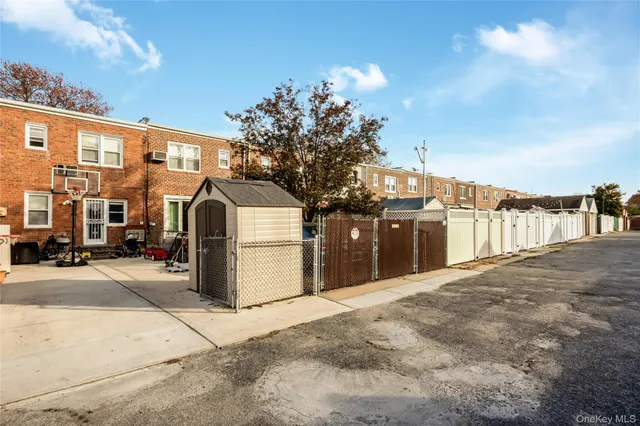 a view of a street with a building in the background