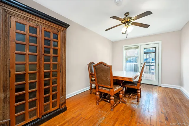 a workspace with wooden floor and a bookshelf