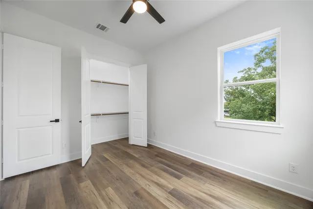 an empty room with a empty space and windows