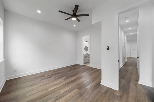 a view of an empty room and wooden floor