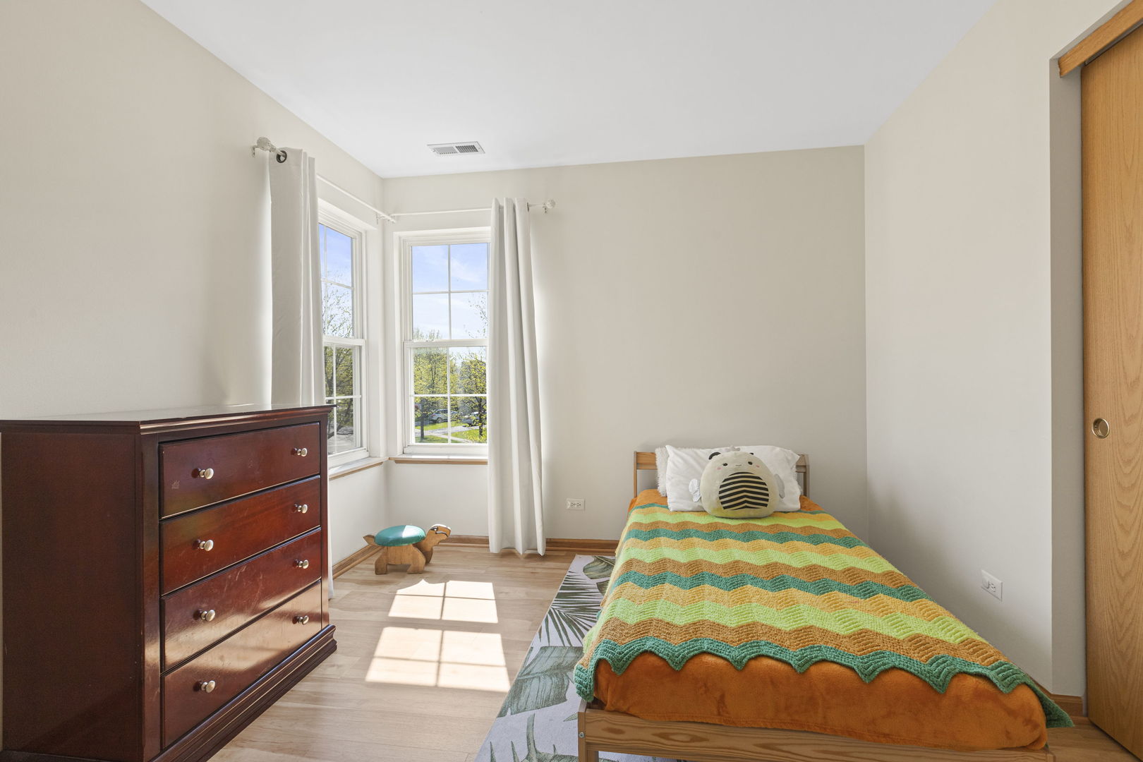 223 Aspen Circle Gilberts, IL 60136 - Photo 13 of 18 a bedroom with a bed and a window