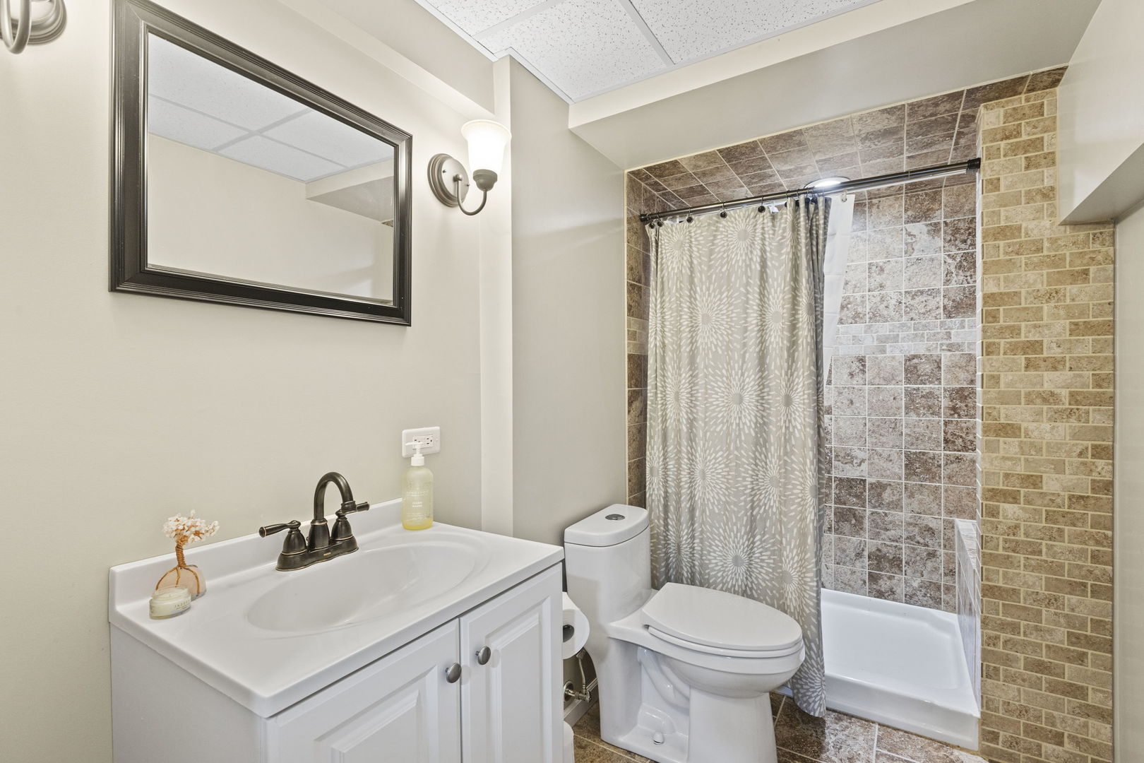 223 Aspen Circle Gilberts, IL 60136 - Photo 16 of 18 a bathroom with a toilet sink and mirror