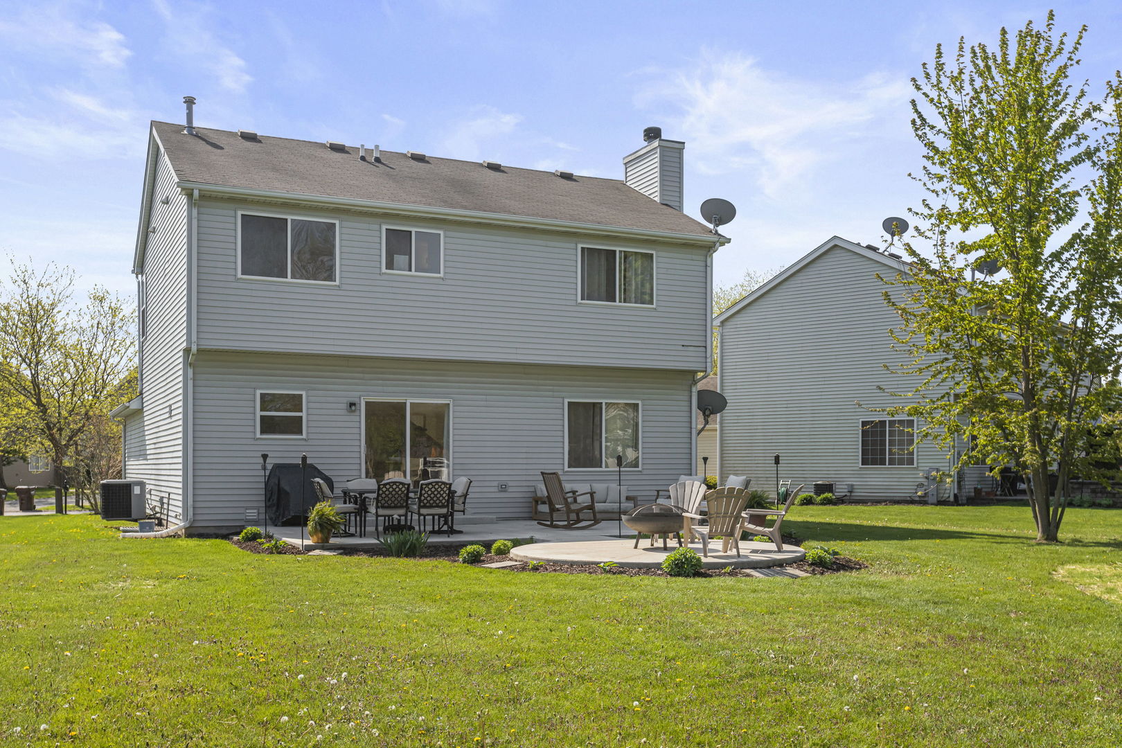 223 Aspen Circle Gilberts, IL 60136 - Photo 18 of 18 a group of people sitting in front of a house