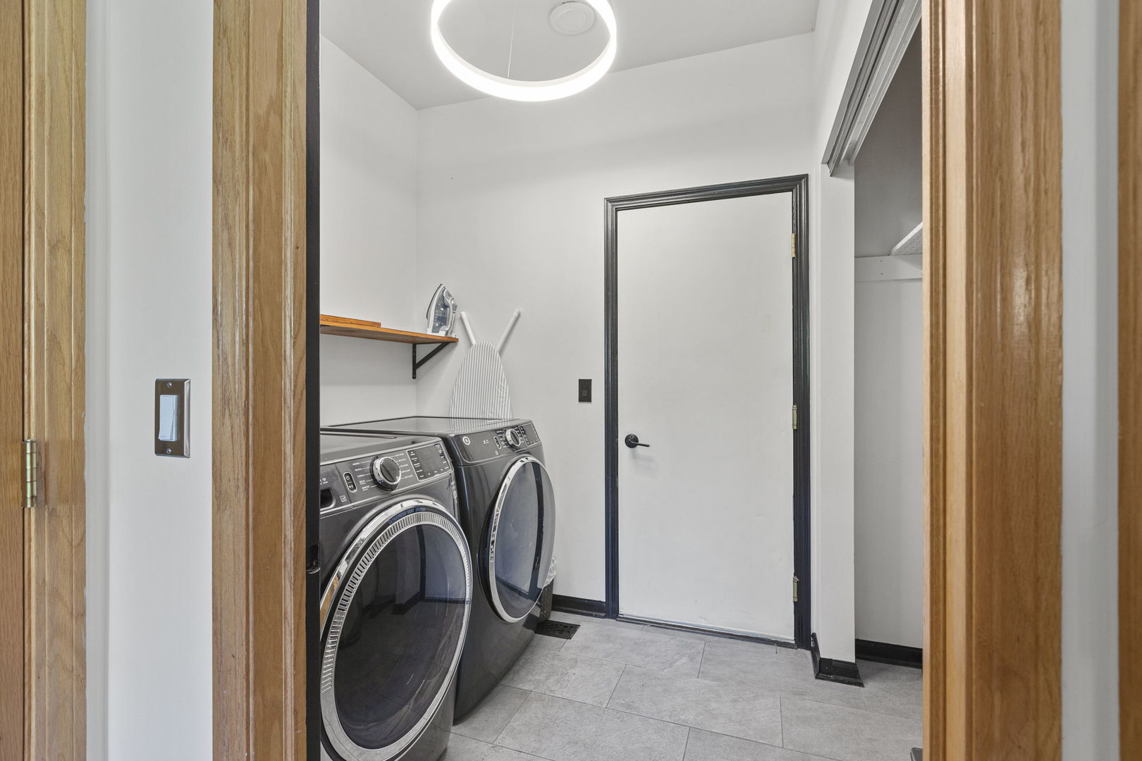 223 Aspen Circle Gilberts, IL 60136 - Photo 8 of 18 a view of a bedroom with washer and dryer