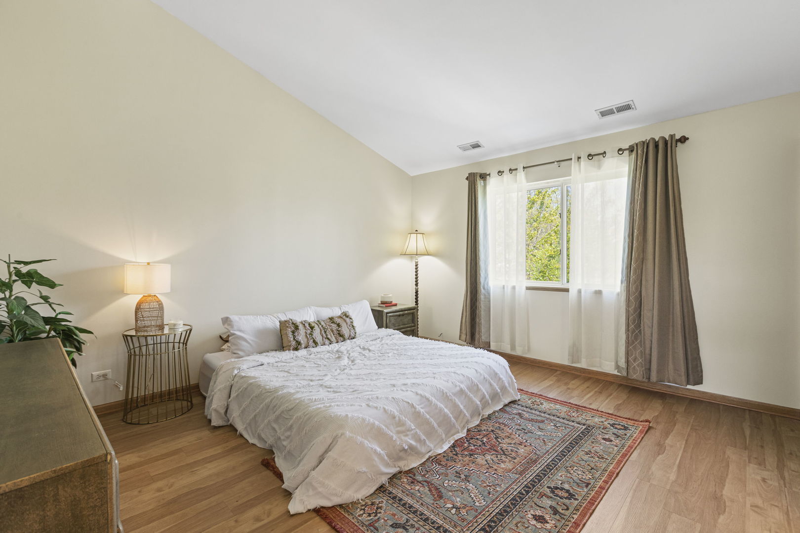 223 Aspen Circle Gilberts, IL 60136 - Photo 9 of 18 a bedroom with a bed and wooden floor