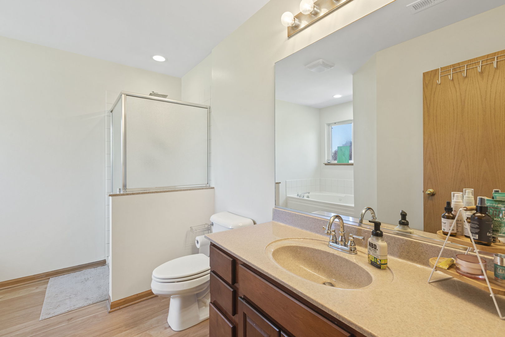 223 Aspen Circle Gilberts, IL 60136 - Photo 10 of 18 a bathroom with a sink toilet and mirror