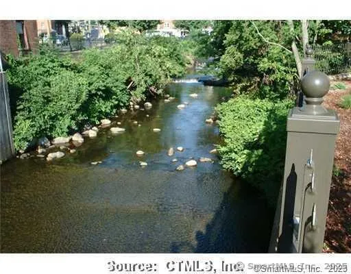 a view of a lake with a yard