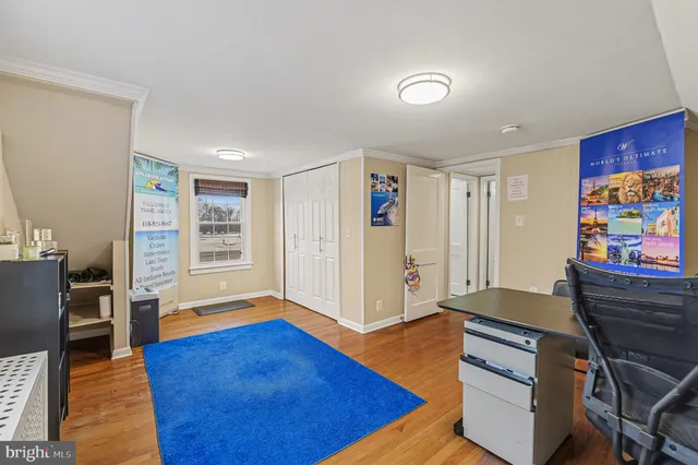 a view of livingroom with hardwood and workspace
