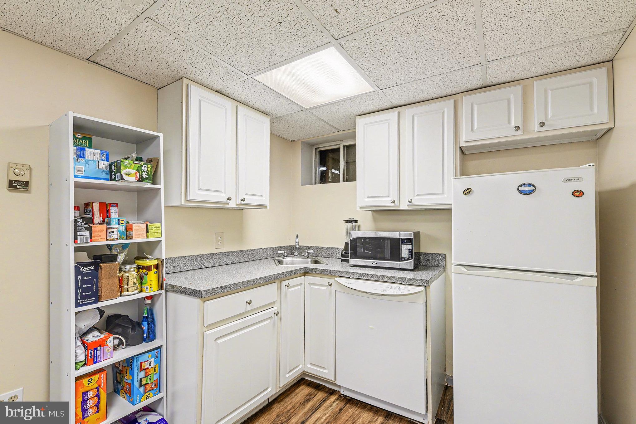1424 East Joppa Road Baltimore, MD 21286 - Photo 16 of 30 a kitchen with stainless steel appliances granite countertop a refrigerator sink and cabinets