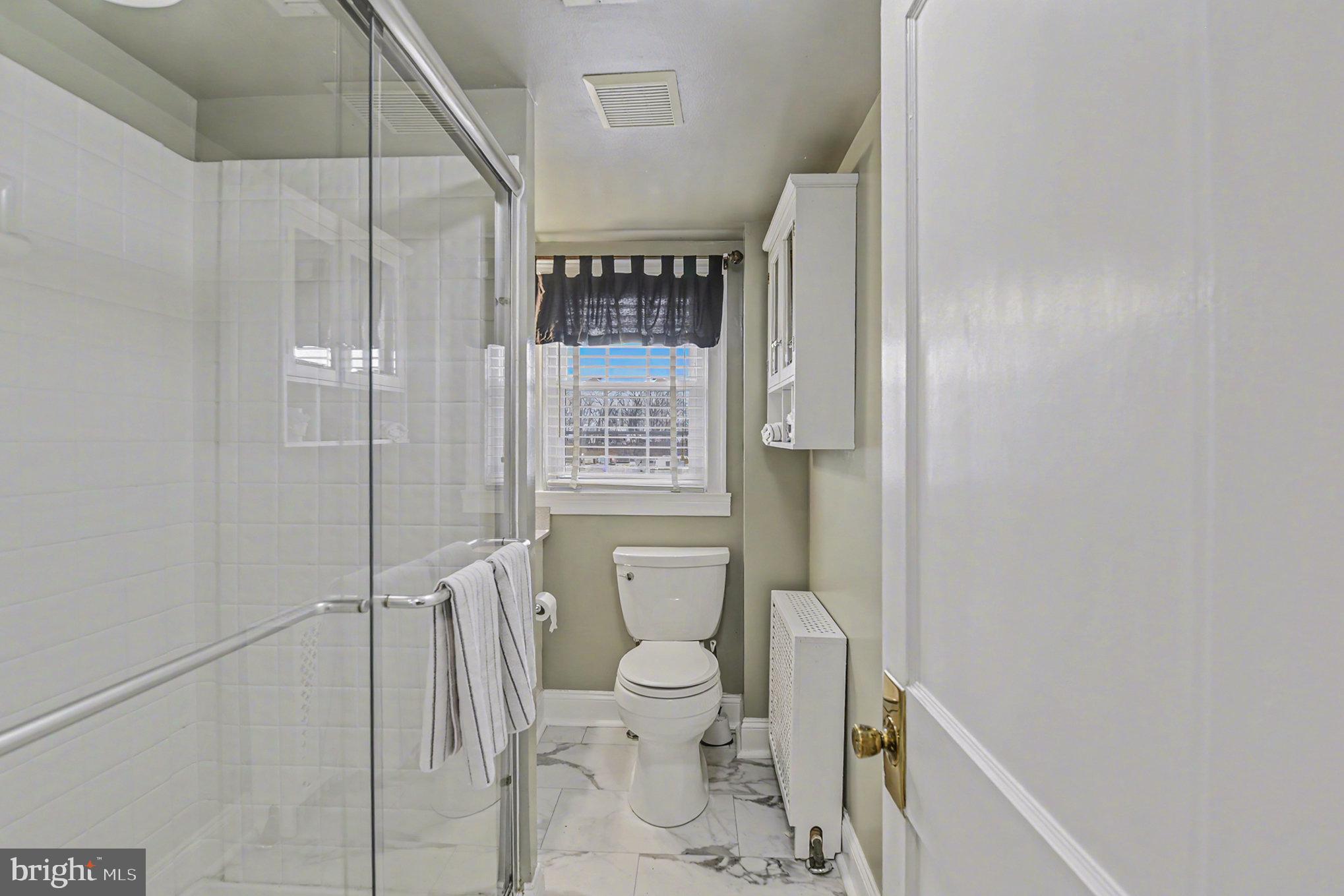 1424 East Joppa Road Baltimore, MD 21286 - Photo 20 of 30 a bathroom with a toilet and a shower