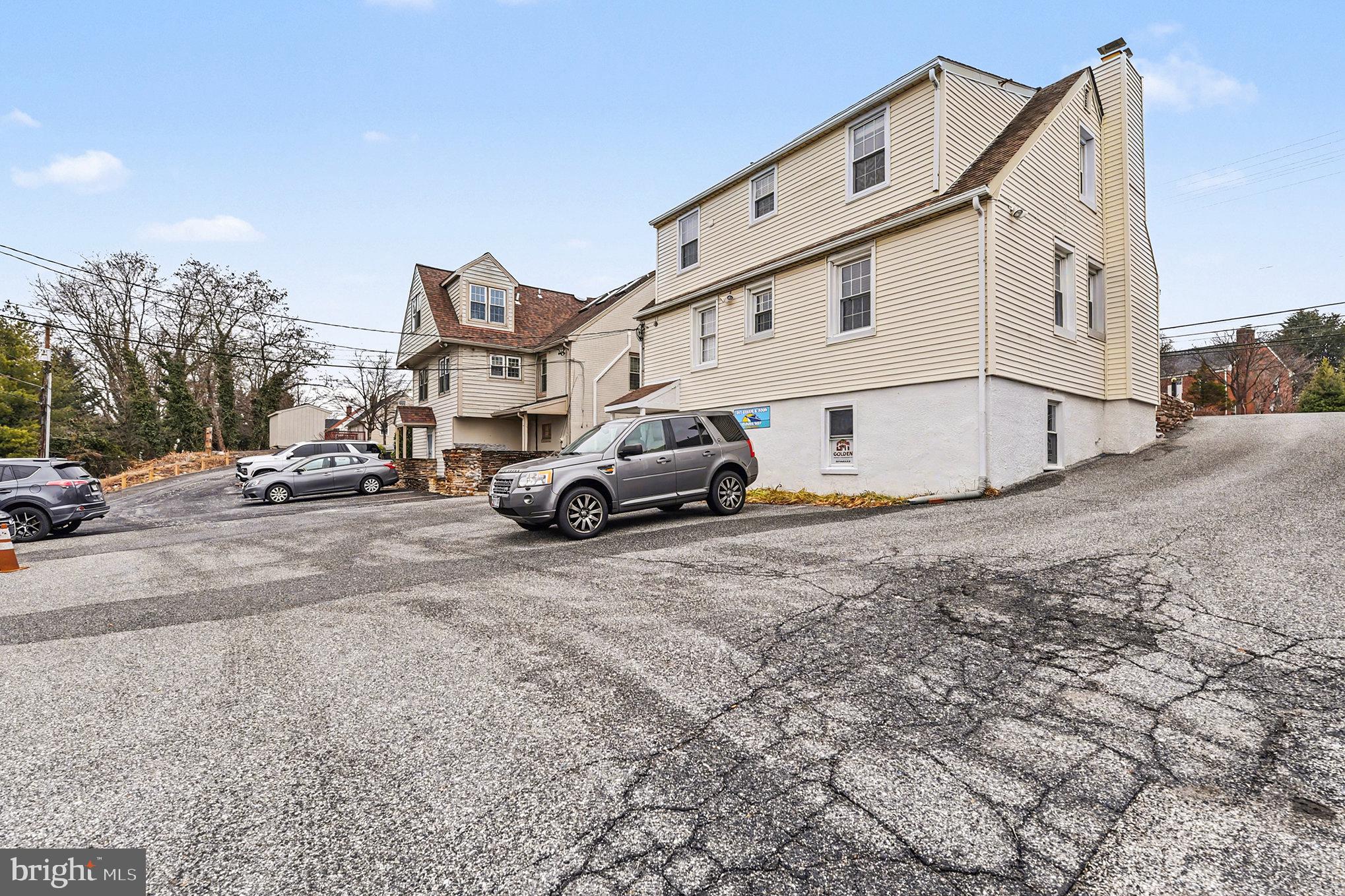 1424 East Joppa Road Baltimore, MD 21286 - Photo 22 of 30 a view of a car park in front of white house