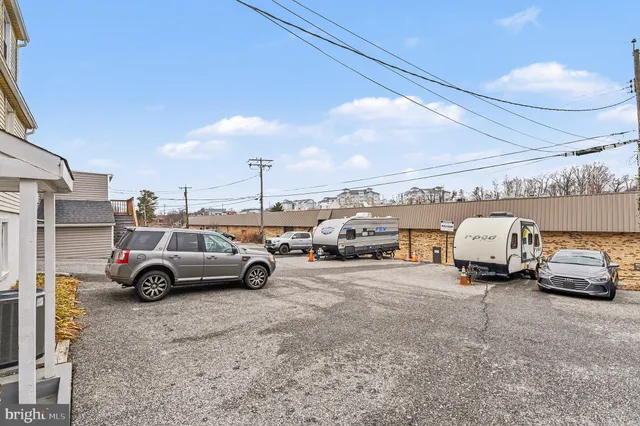 a view of parking space with parked cars