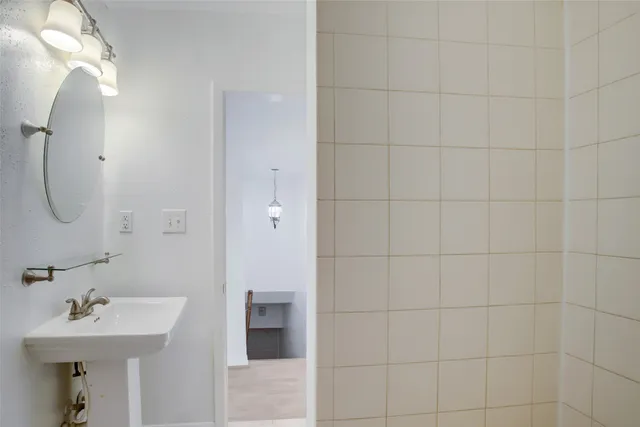 a green field with trees in the background