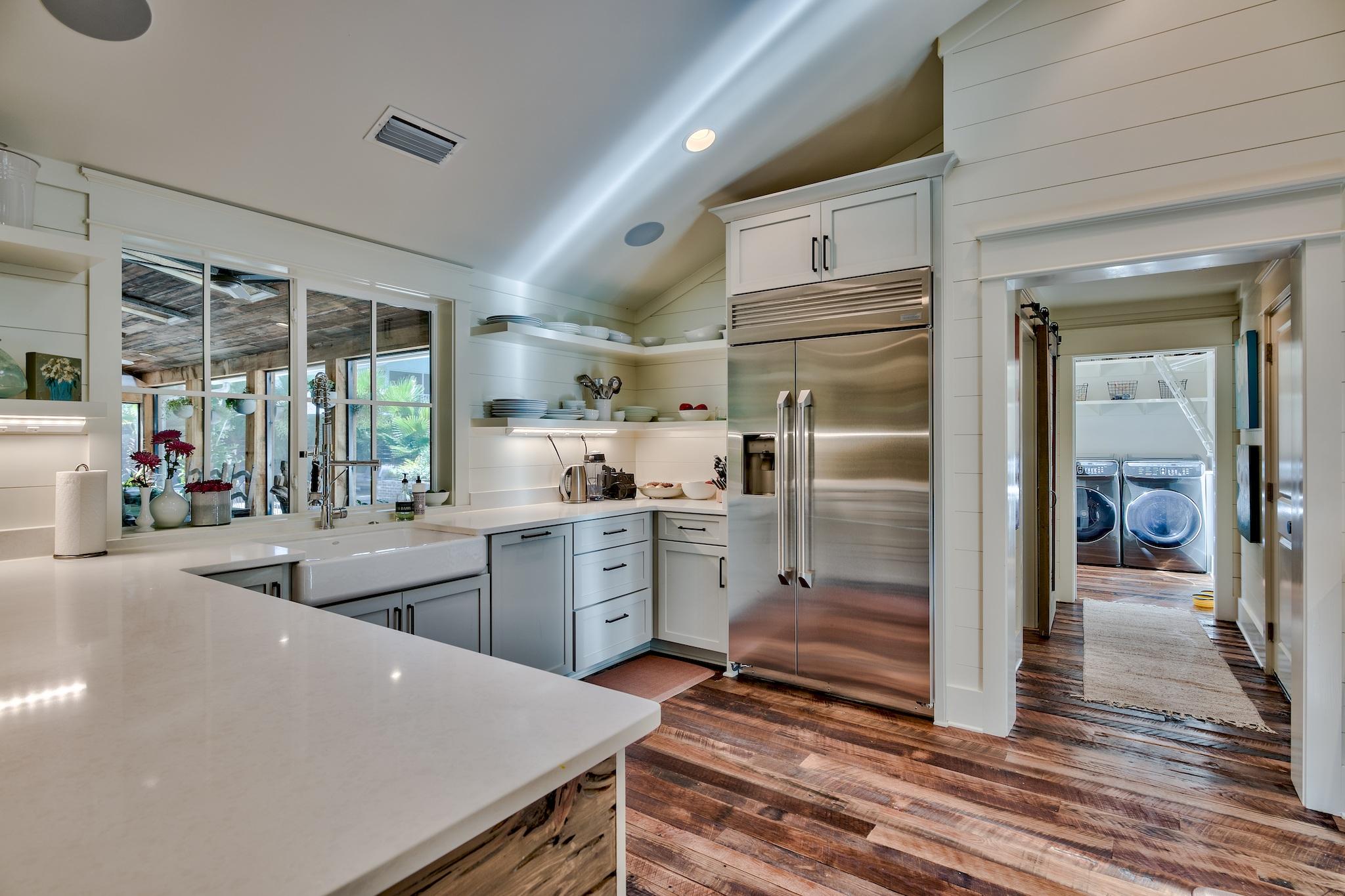 102 Camp Creek Road South Inlet Beach, FL 32461 - Photo 13 of 58 a kitchen with sink refrigerator and cabinets