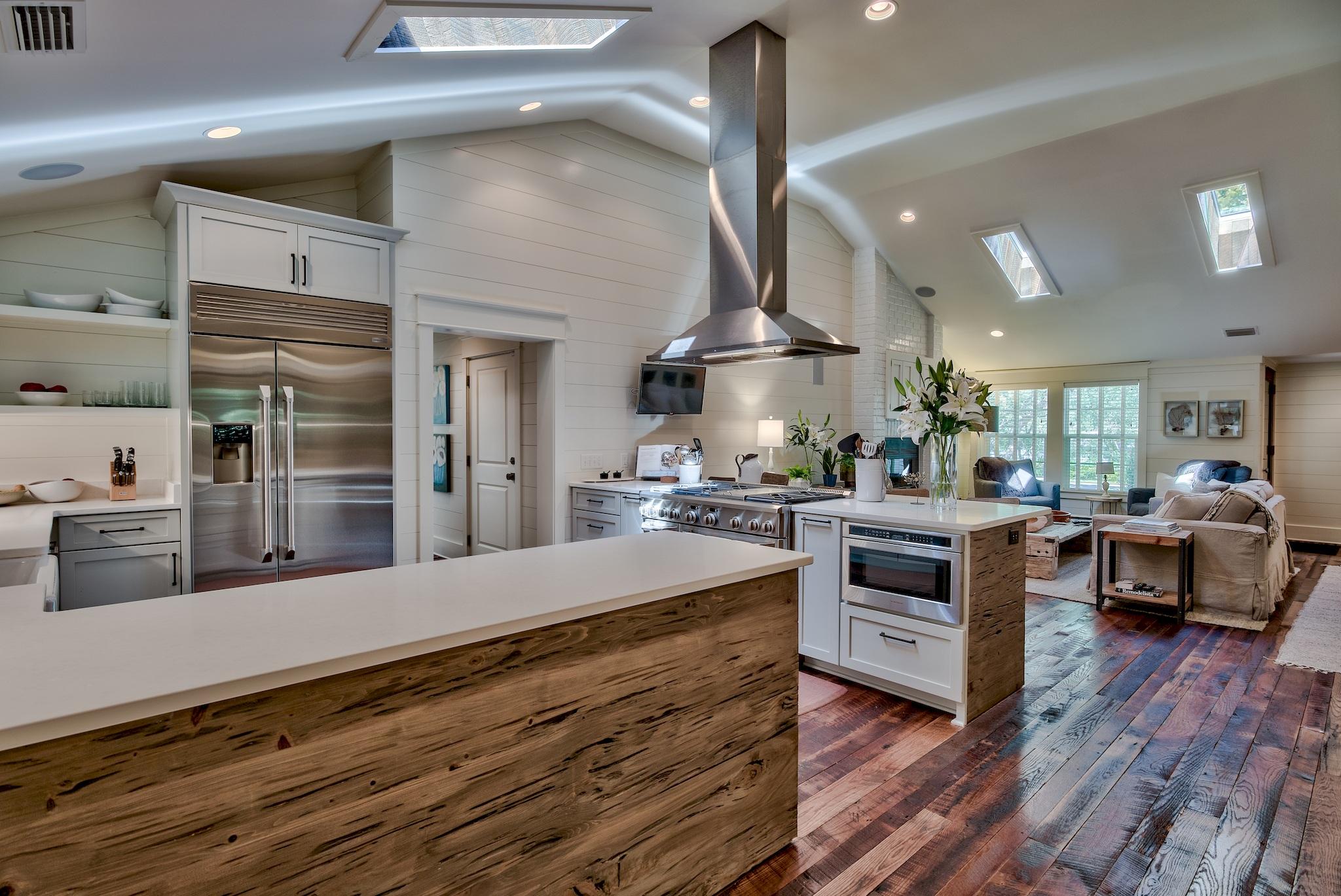 102 Camp Creek Road South Inlet Beach, FL 32461 - Photo 14 of 58 a large kitchen with stainless steel appliances a large counter top a stove and a wooden floors